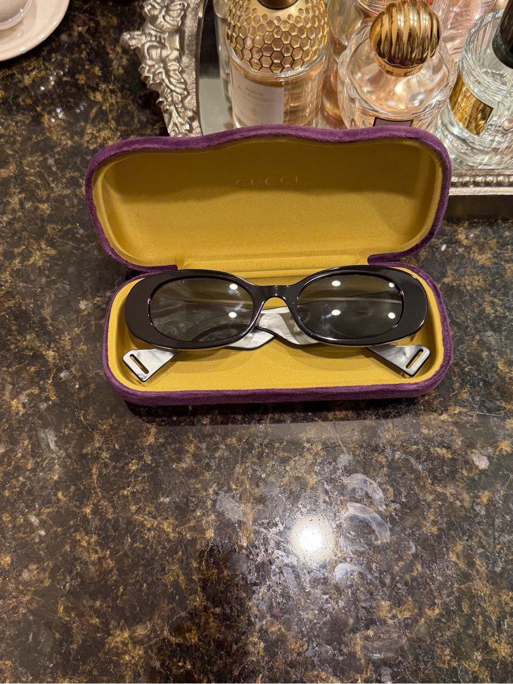 Gucci Black Oval Sunglasses with Yellow Velvet Case